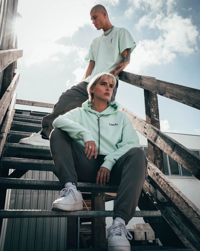 Friends wearing streetwear on outdoor stairs