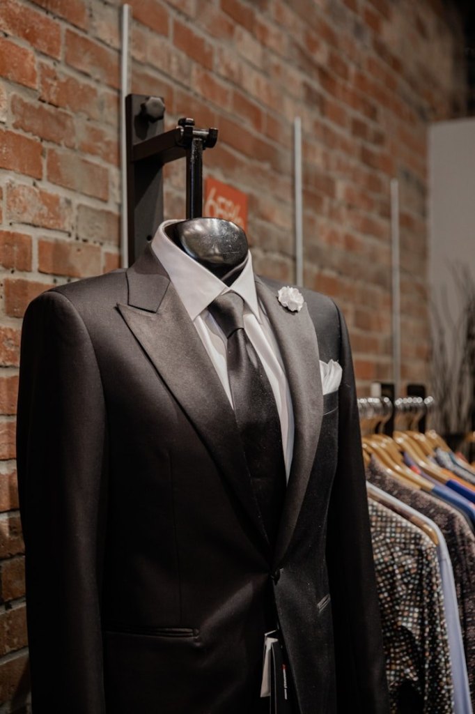 Black suit on a tailor mannequin in a showroom