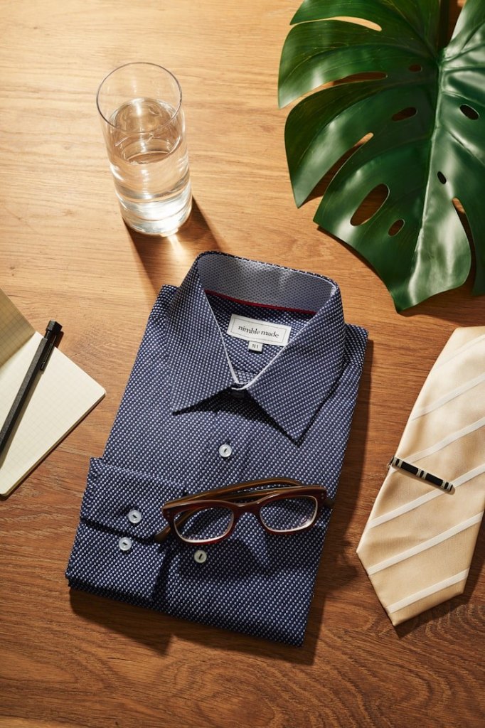 Dress shirt with glasses and a tie clip