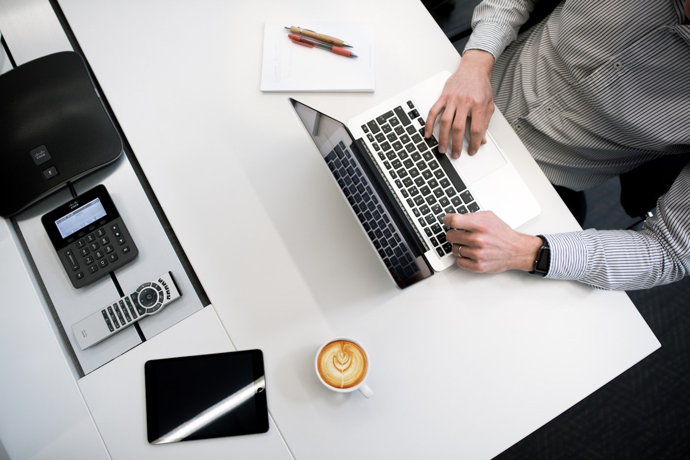 Team planning at a desk with a laptop