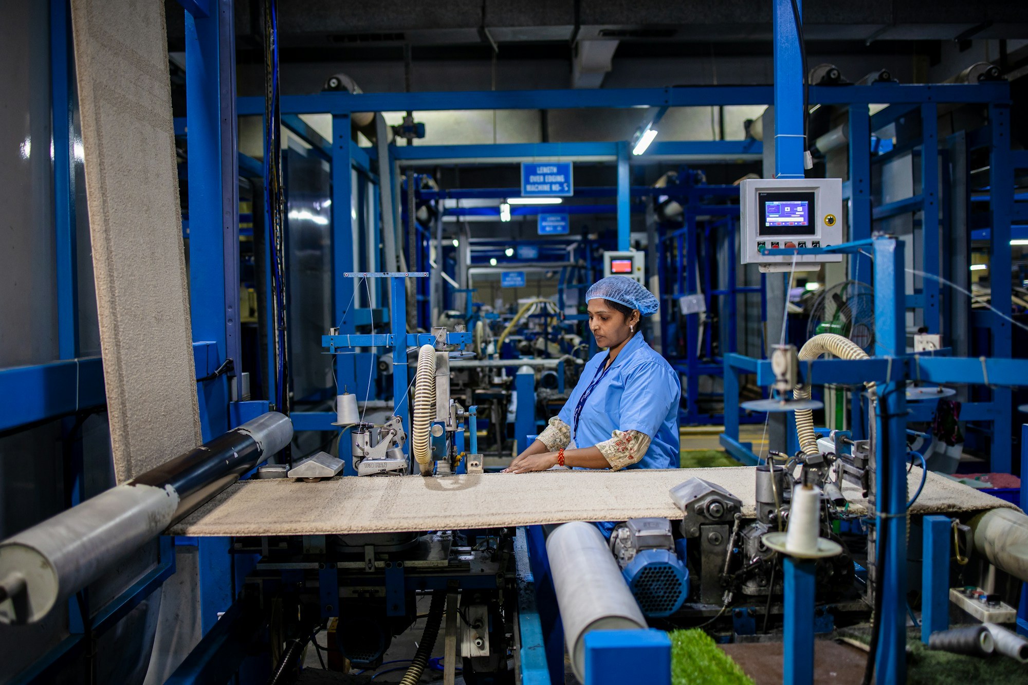 Technician working at a textile machine